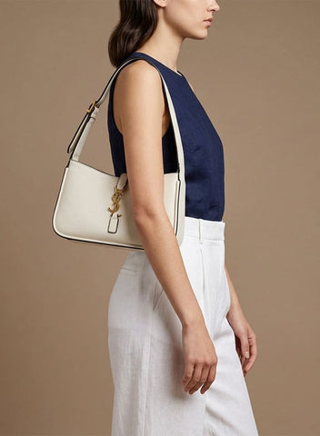 Saint Laurent : Cuir blanc et fermoir doré