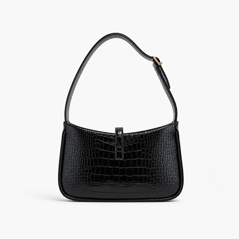 Saint Laurent : Noir élégant avec détails dorés