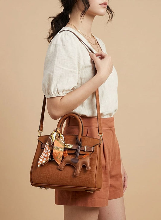 Birkin d'Hermès Cuir camel et accessoires orange