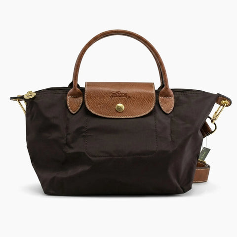 Le Pliage Neo: Noir avec des détails en cuir marron.