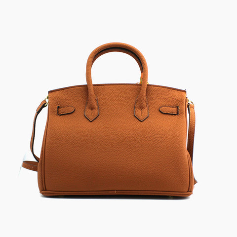 Birkin d'Hermès Cuir camel et accessoires orange