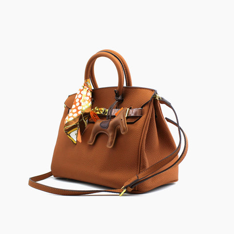 Birkin d'Hermès Cuir camel et accessoires orange