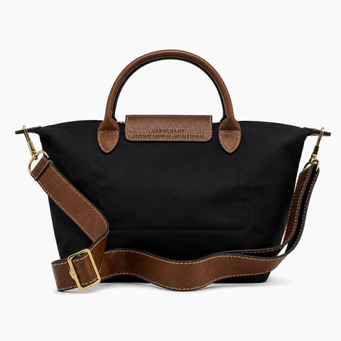 Le Pliage Neo: Noir avec des détails en cuir marron.