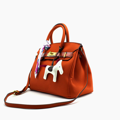 Birkin d'Hermès Cuir orange et accessoires blanc et violet