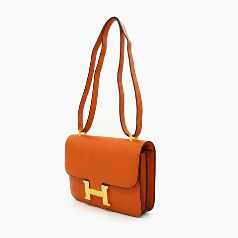 Hermès Constance: Orange cognac et doré-